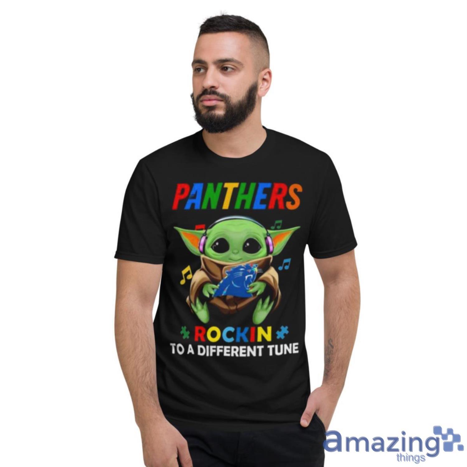 Baby Yoda Hug Carolina Panthers Autism Rockin To A Different Tune Shirt - Short Sleeve T-Shirt